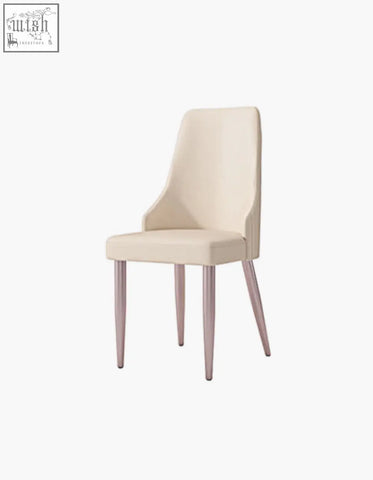 Cream-colored upholstered eira dining chair with sleek tapered metallic legs offering financing and low shipping cost