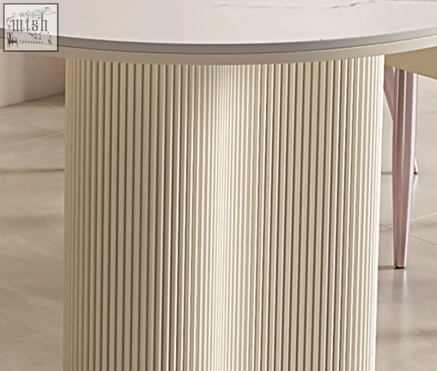 Eira white dining table with a smooth white top and cream ribbed base perfect for stylish white dining spaces