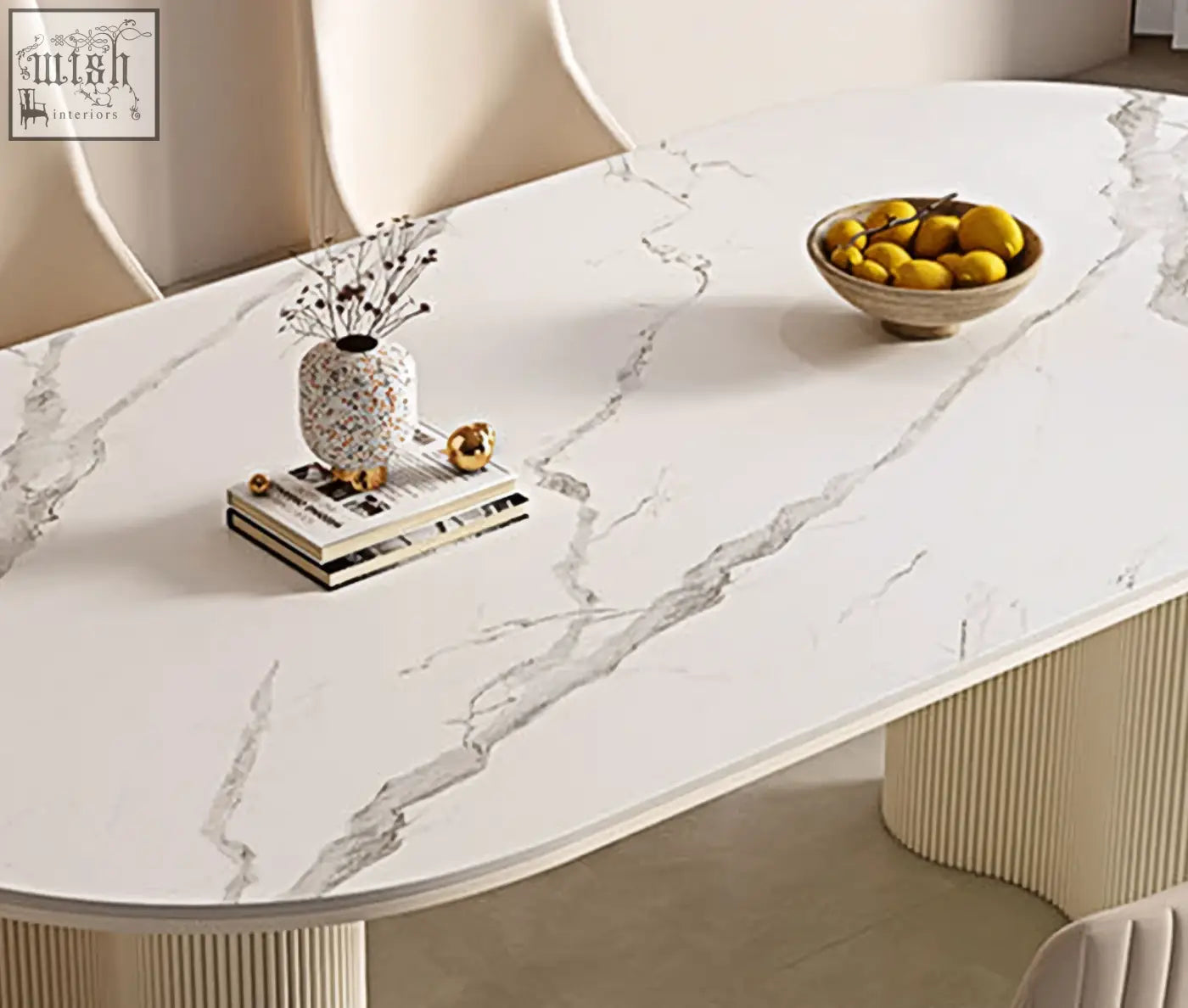 Eira white dining table with oval white marble effect top and ribbed cream legs perfect for white dining spaces