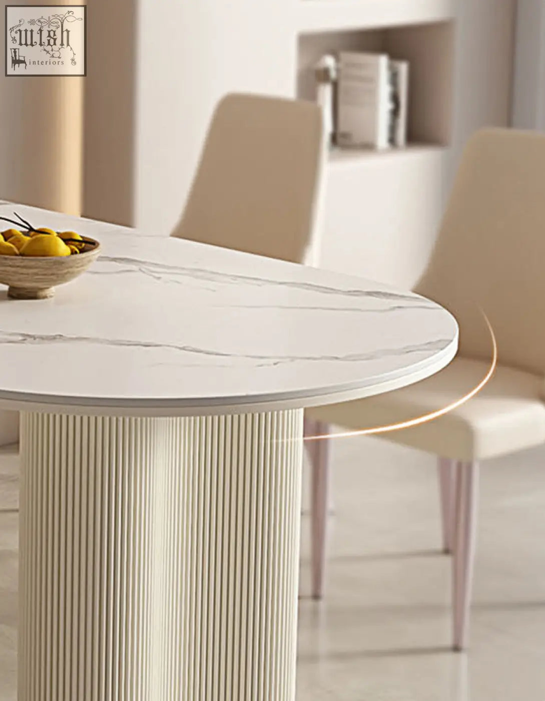 Eira white dining table with oval white marble effect top and sleek ribbed pedestal base perfect for white dining spaces