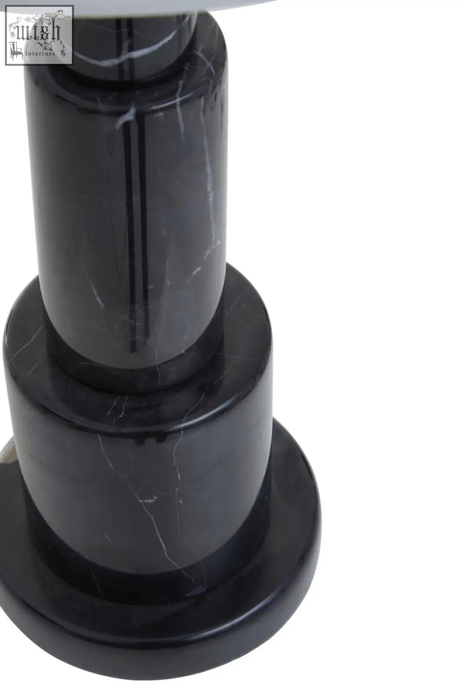 Elara black marble table lamp with ivory shade featuring a sleek black marble base with tiered cylindrical sections and white veining
