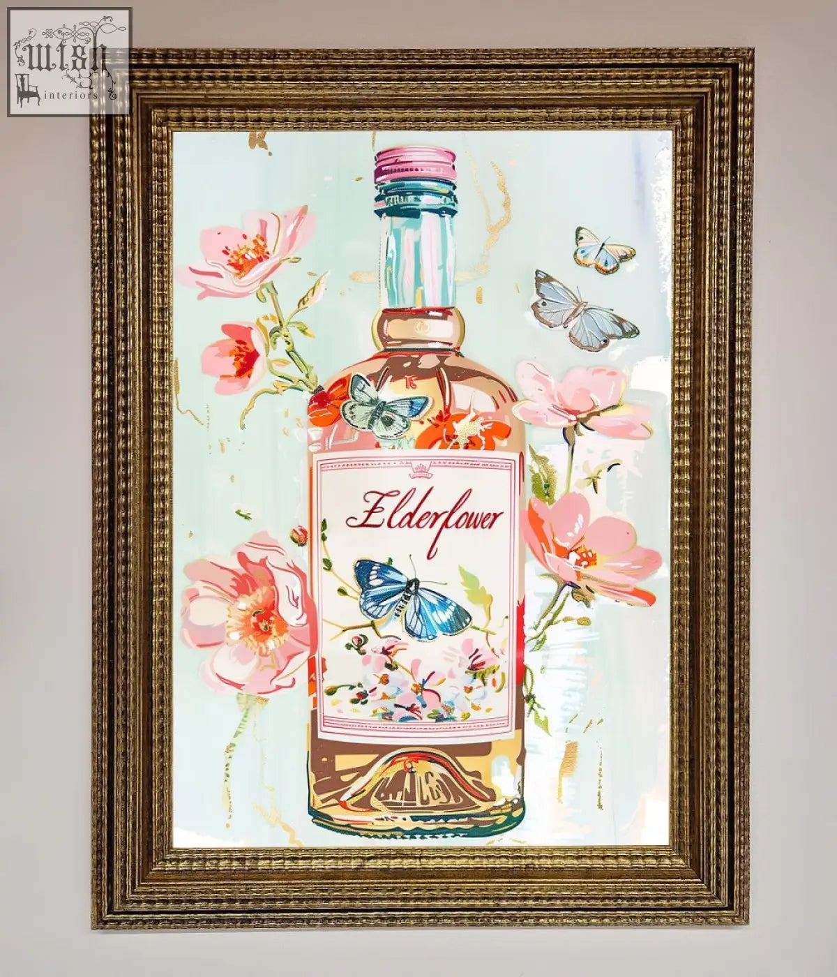 A framed elderflower wine wall art featuring a pink and gold elderflower gin bottle with floral and butterfly designs
