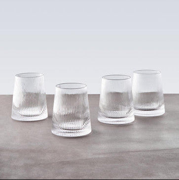 Eldon set of four clear glass tumblers with vertical ribbed texture and slightly flared base for everyday use