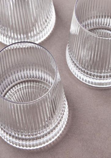 Eldon set of four clear glass tumblers with vertical ribbed texture and subtly fluted base perfect for everyday use