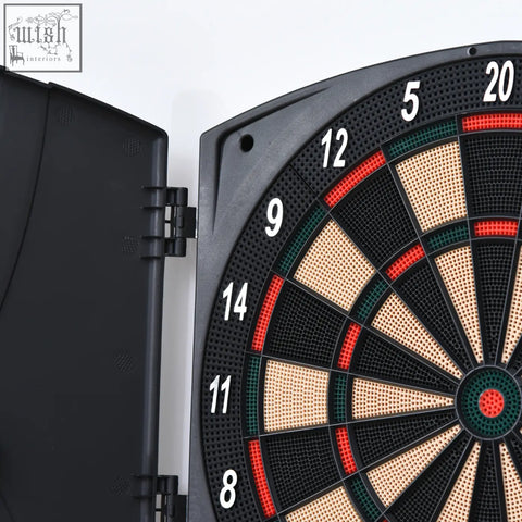 Black plastic electronic dartboard with perforated surface red green zones white numbers and bullseye includes darts