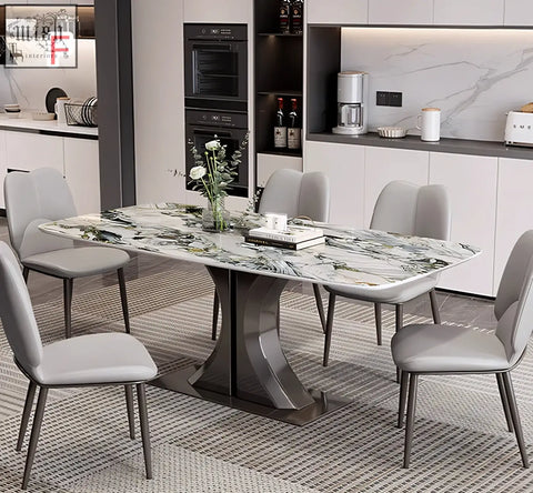 Modern elena dining table with marble top and sleek curved metallic base paired with gray chairs for stylish dining space
