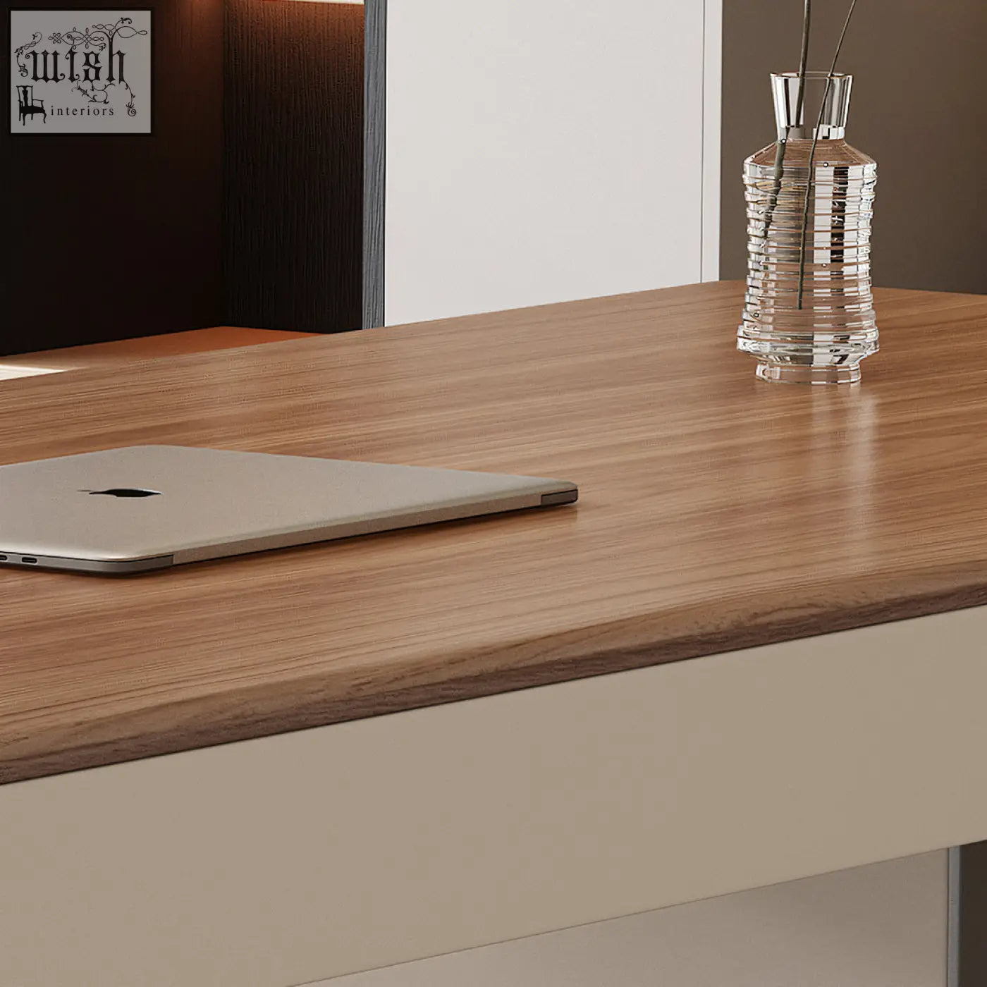 Silver apple macbook laptop resting on wooden surface of elena modern office desk with cream and walnut finish