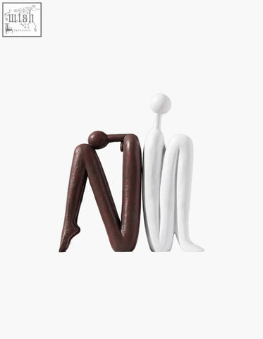 Eleni bookends for shelves decorative resin sculpture in brown and white showing two stylized seated human forms shipping cost may apply
