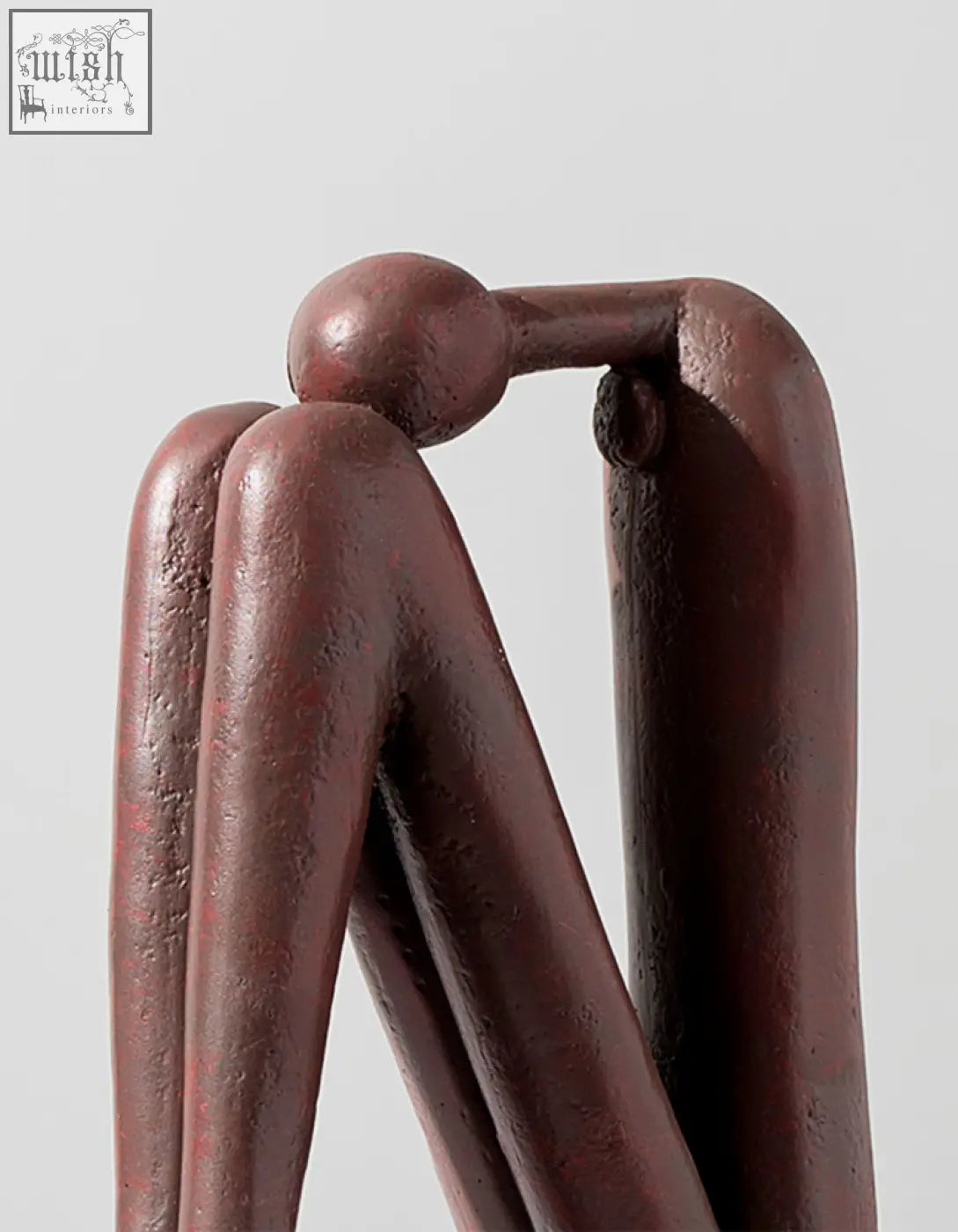 A matte dark brown resin eleni bookends featuring abstract human forms perfect for shelves decorative use with offer financing and shipping cost options