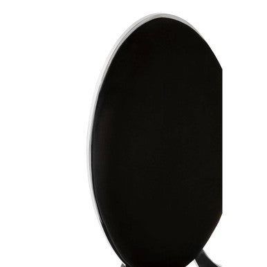 Black oval-shaped speaker with sleek silver rim paired with eliza black velvet dining chair for stylish dining spaces