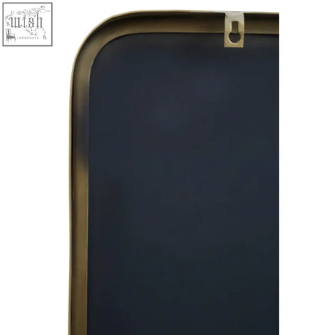A sleek navy blue chalkboard with a polished brass frame in the modern ella gold wall mirror style gold wall mirror