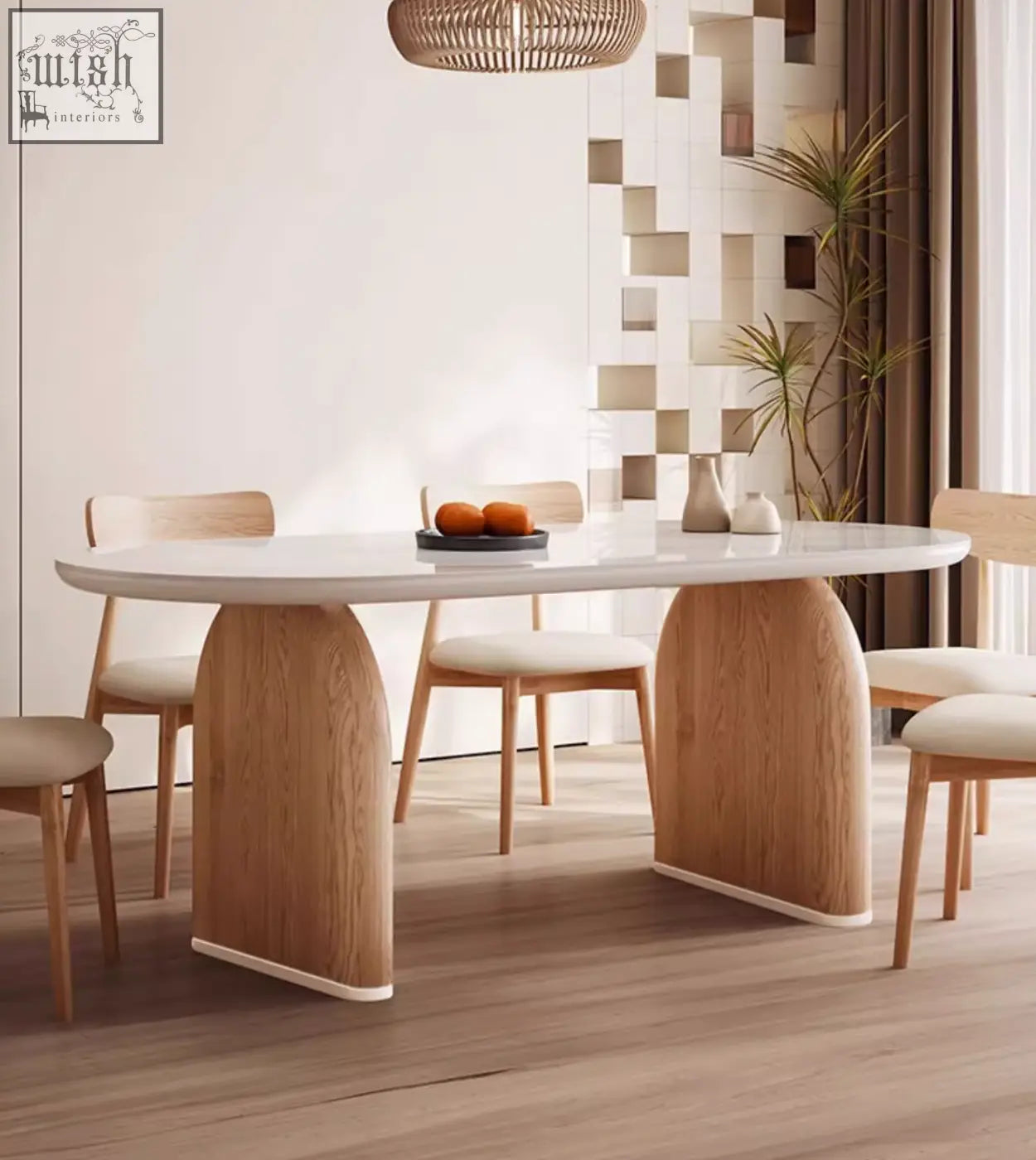 Ellison modern dining table with a sleek white sintered stone top and curved light oak wooden legs