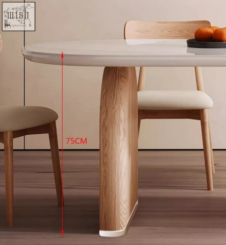 Ellison modern dining table with smooth white sintered stone top and single curved wooden leg at 75cm height