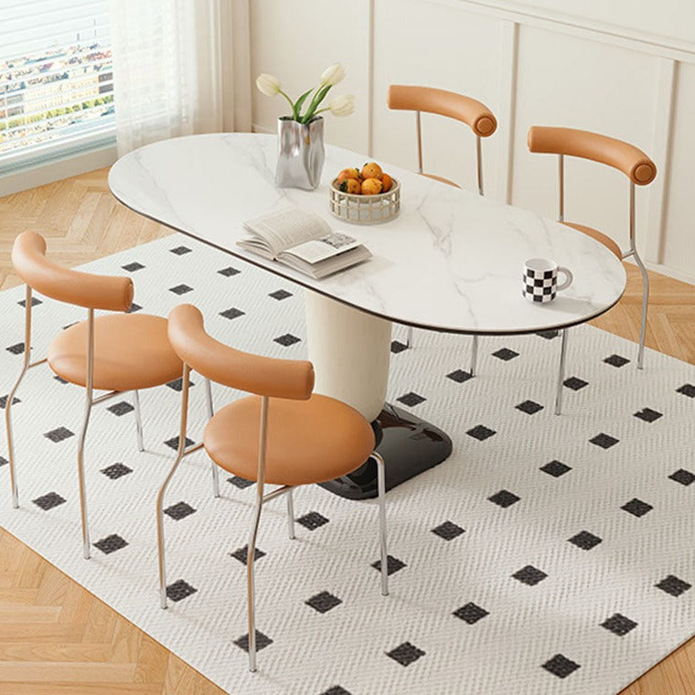 White marble oval elmer dining table with sleek modern pedestal base and minimalist chrome legs for stylish dining use
