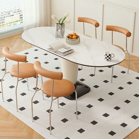 White marble oval elmer dining table with sleek modern pedestal base and minimalist chrome legs for stylish dining use