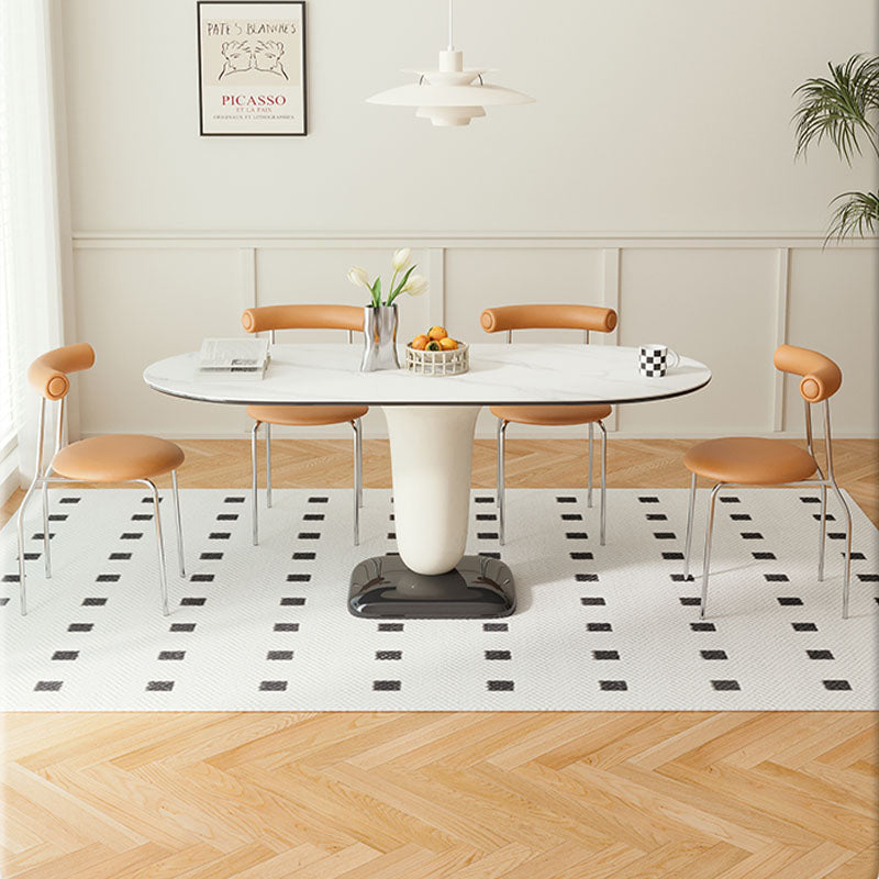 White oval elmer dining table with sleek curved pedestal base and minimalist chrome legs for modern dining spaces