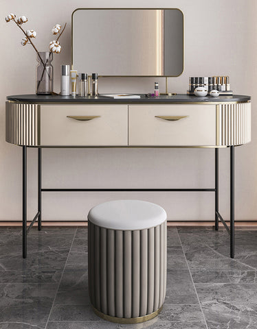 Cream-colored elmore dressing table with gold-toned accents and vertical fluted sides paired with matching stool