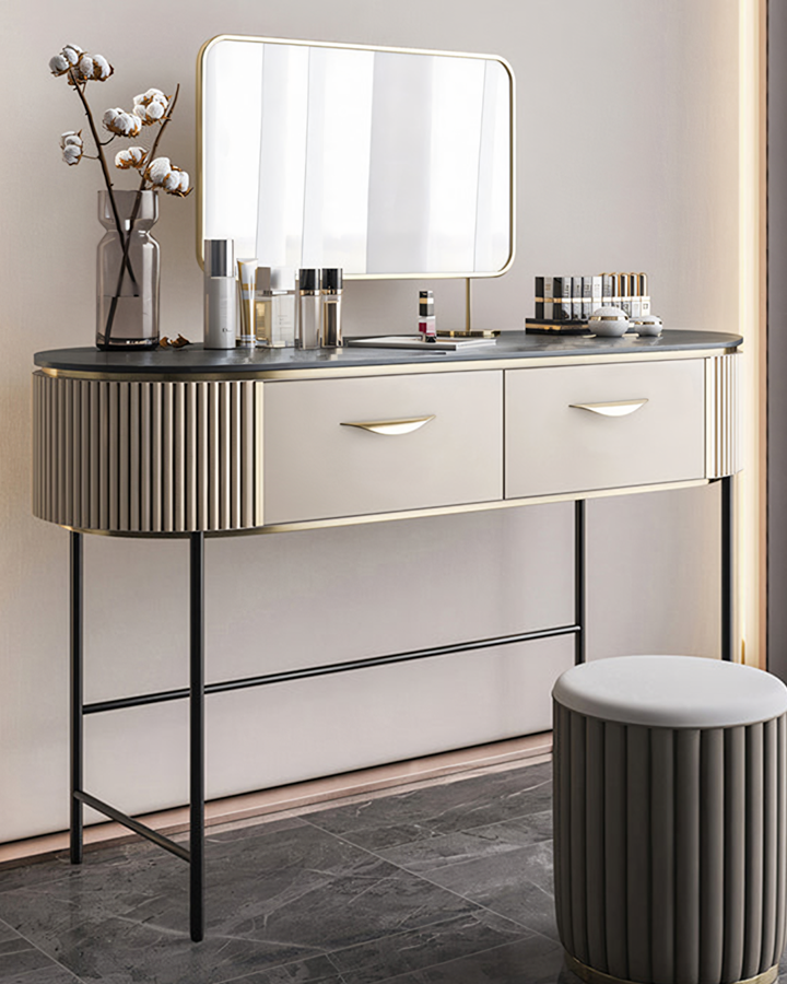 Modern elmore dressing table with sleek black marble top, fluted beige sides, gold handles, and slim black metal legs