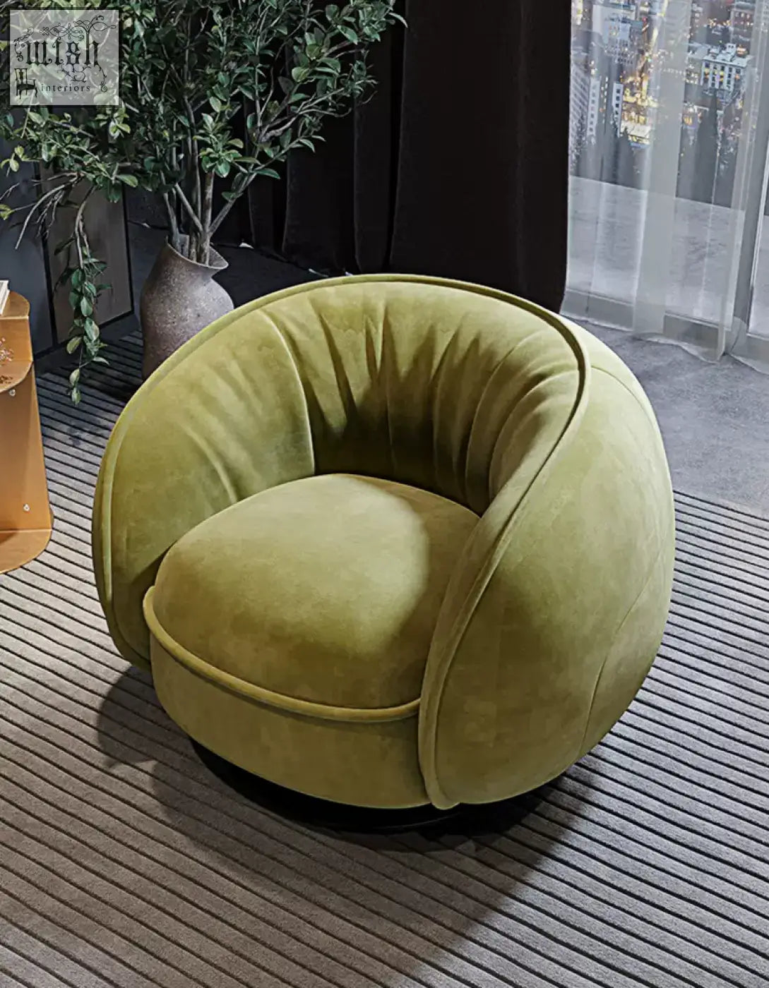 A plush olive green velvet elowen swivel lounge chair with a rounded cocoon design and black base