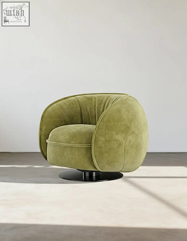 Olive green velvet elowen swivel lounge chair with sleek black circular base perfect for vintage style seating