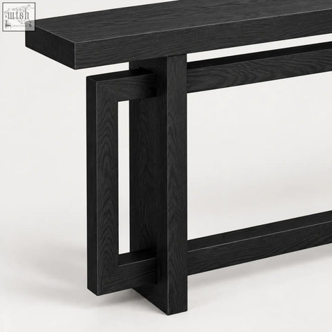 Black oak console table with sleek modern design and geometric leg structure in black wood effect finish