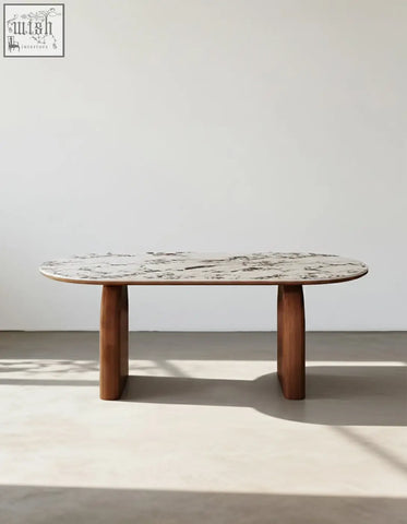 Elegant emerson dining table with an oval white and gray marble sintered stone top and dark wood legs
