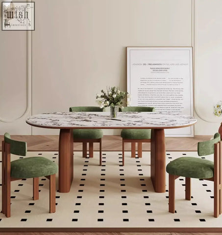 Elegant emerson dining table with white marble top and wooden legs surrounded by green upholstered chairs