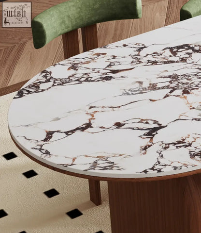 Elegant emerson dining table with white marble top featuring brown and gold veining supported by sleek wooden legs