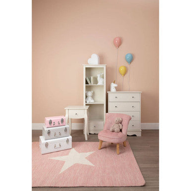 Pink star patterned rug in front of emily ivory 4 drawer chest with ivory finish and sleek design