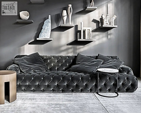 Dark gray velvet tufted emrys chesterfield corner three seater sofa with plush cushions and multiple throw pillows