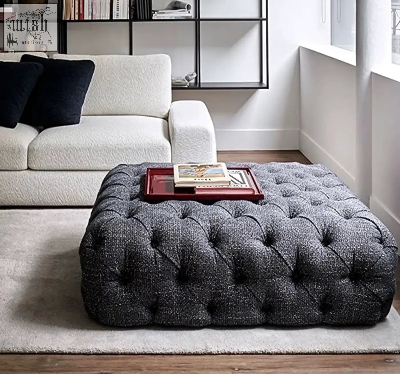 Gray tufted ottoman with textured fabric surface complementing the emrys chesterfield corner sofa setup