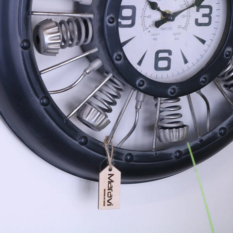 Engine style industrial wall clock 40cm with black metal frame white face bold numerals and exposed metallic springs gears