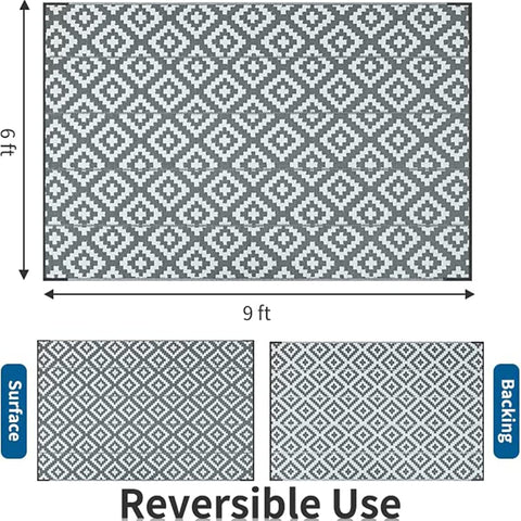 Gray and white geometric patterned reversible nylon outdoor rug with nylon corner loops to reduce slippery accidents and prevent daily fraying
