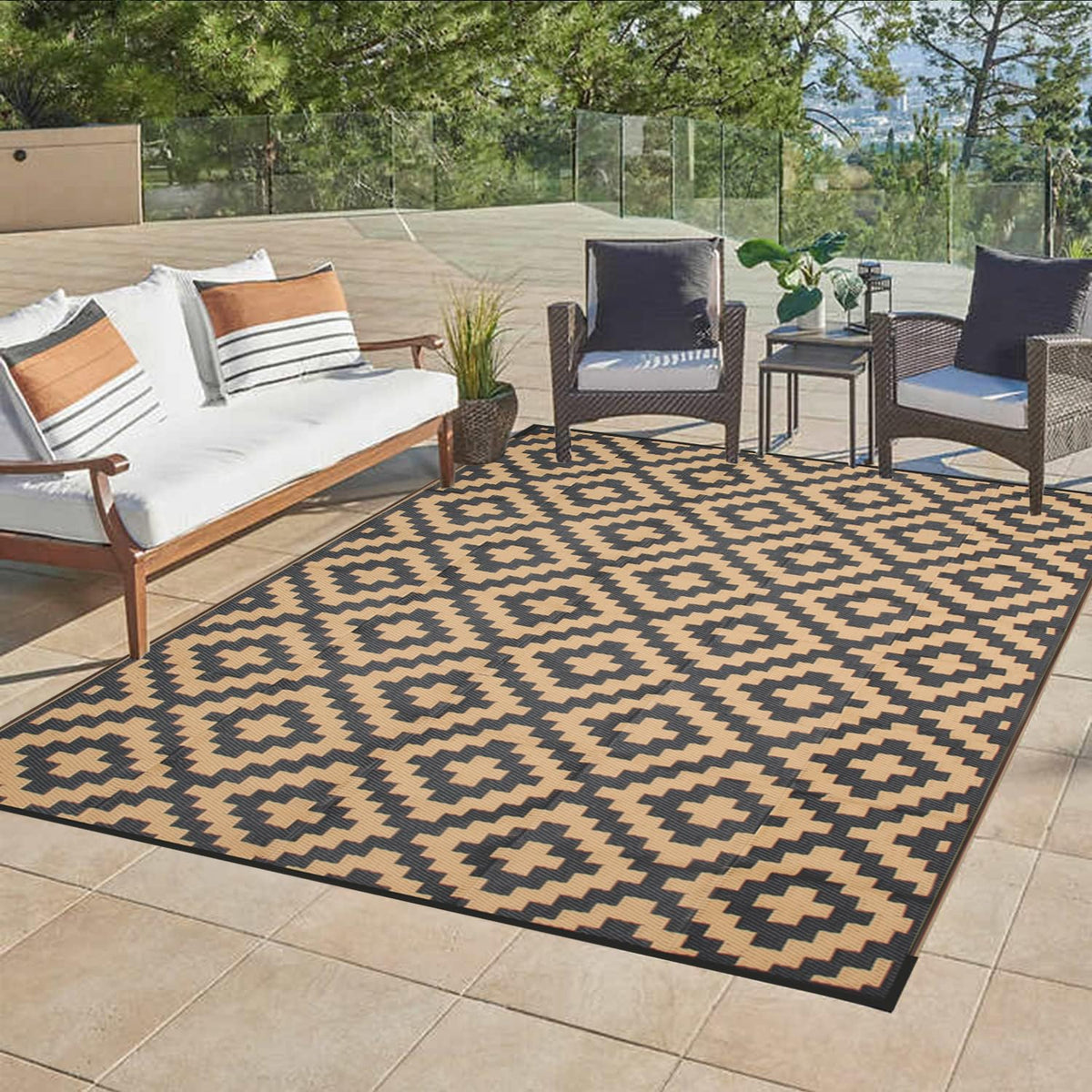 Beige and black geometric patterned enipate outdoor rug with nylon corner loops to reduce slippery accidents and prevent fraying
