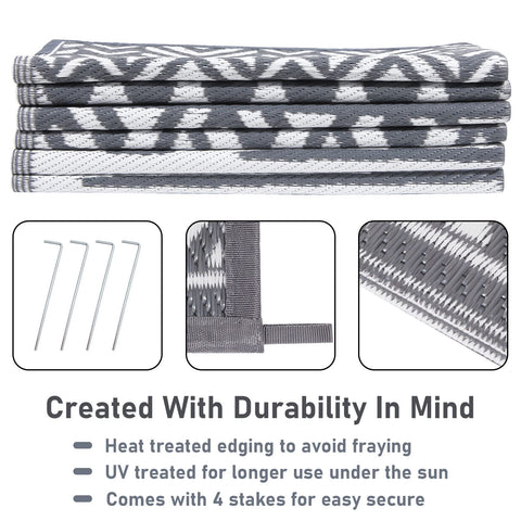 Stacked gray and white woven enyhom large grey outdoor rug with durable heat-treated edging for outdoor patio use