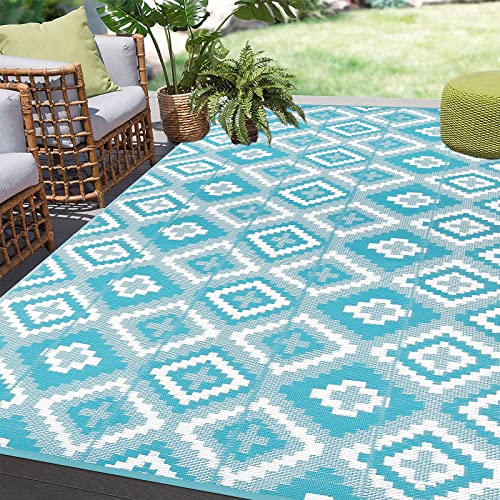 Teal and white geometric pattern enyhom large outdoor rug with woven plastic straw texture for garden and patio use