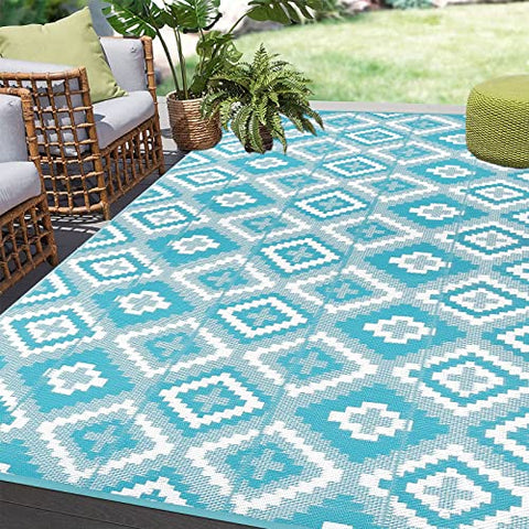 Teal and white geometric pattern enyhom large outdoor rug with woven plastic straw texture for garden and patio use