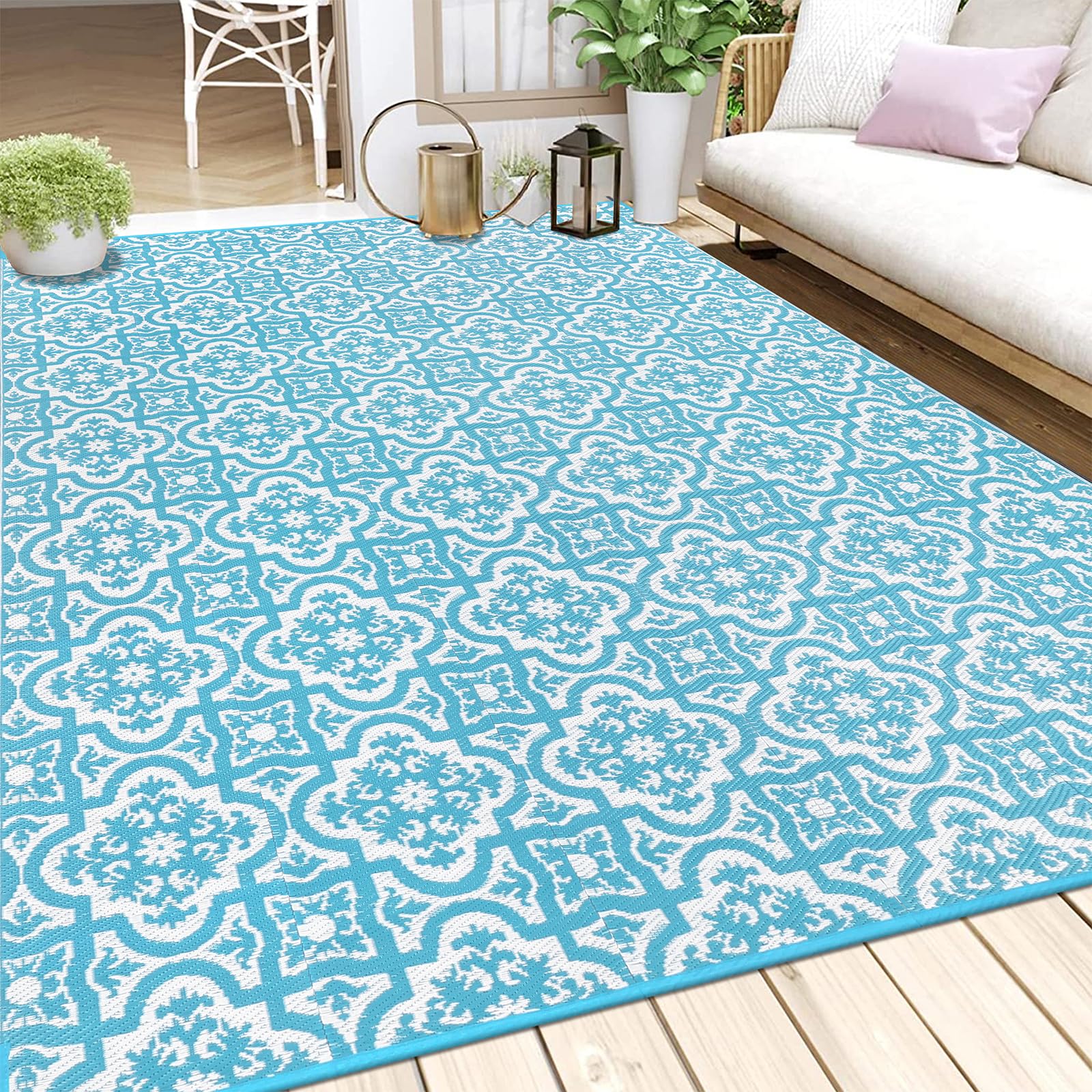 Turquoise and white patterned reversible outdoor rug made of plastic straw perfect for garden or patio use