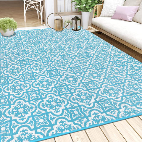Turquoise and white patterned reversible outdoor rug made of plastic straw perfect for garden or patio use