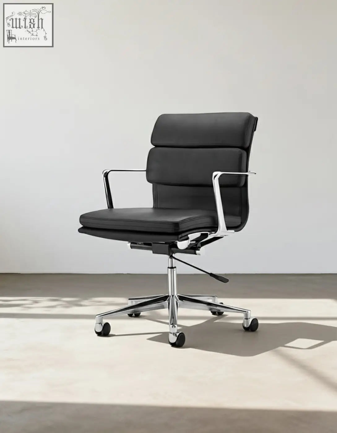 Black leather ergo office chair lowback with chrome metal frame and five-star base for office use