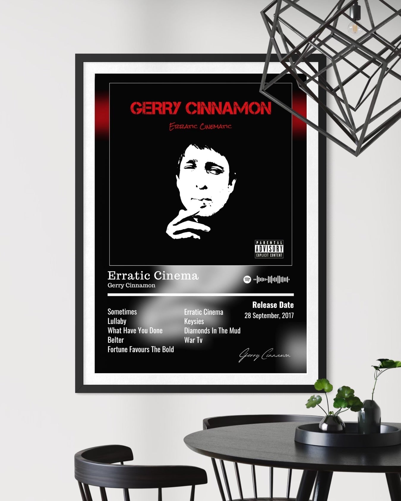 Black and white framed gerry cinnamon erratic cinema album poster with bold red text portrait tracklist and signature