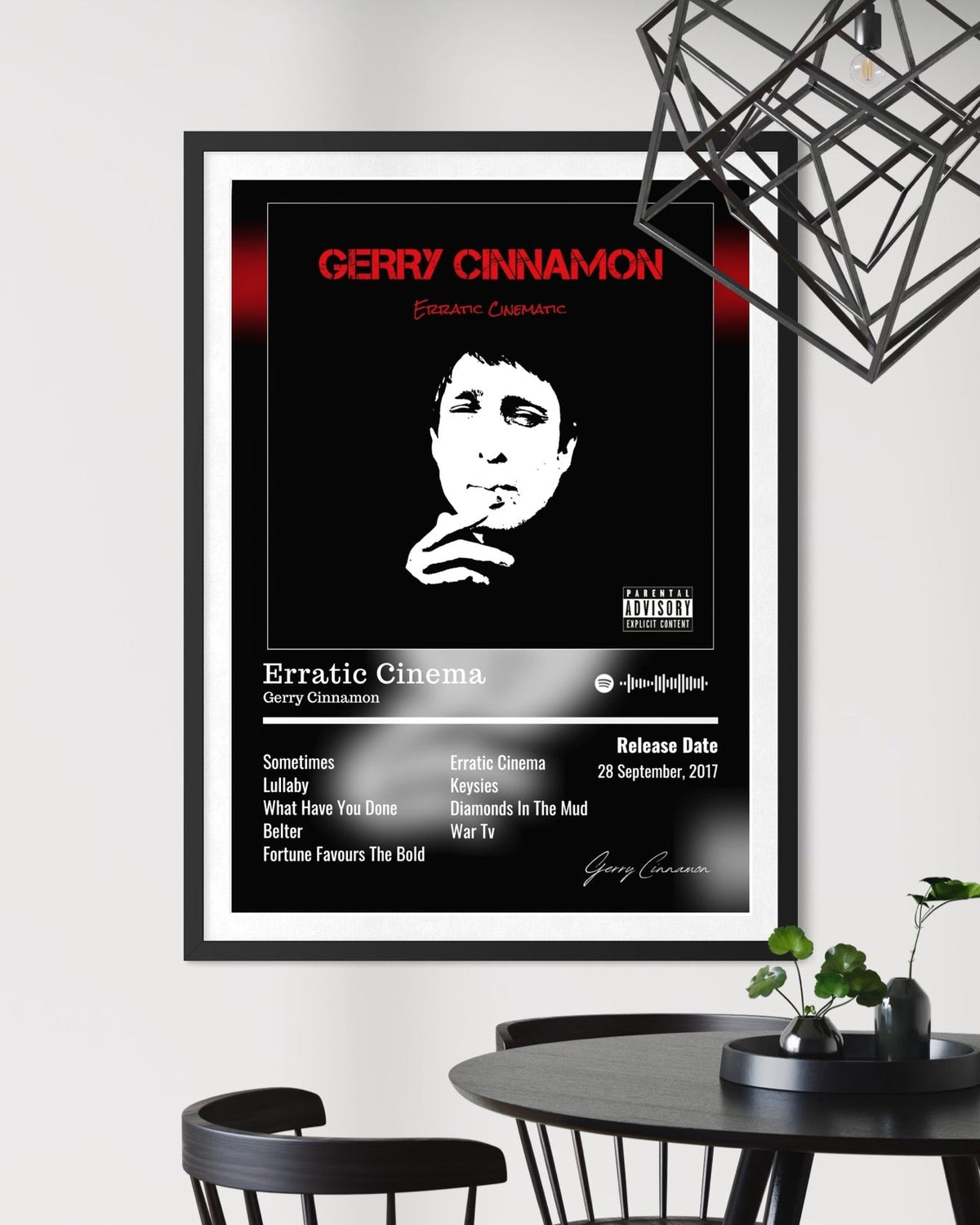 Black and white framed gerry cinnamon erratic cinema album poster with bold red text portrait tracklist and signature