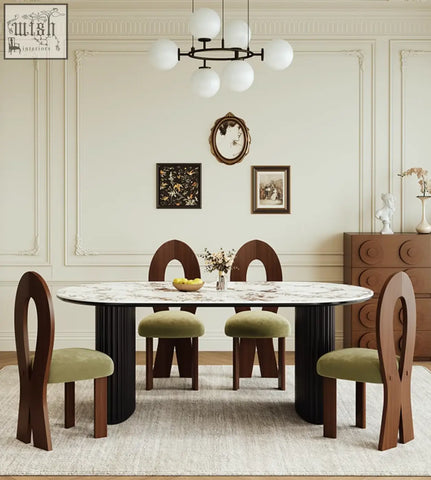 Modern escobar dining table with white sintered stone oval top and sleek black cylindrical legs for diningroom use