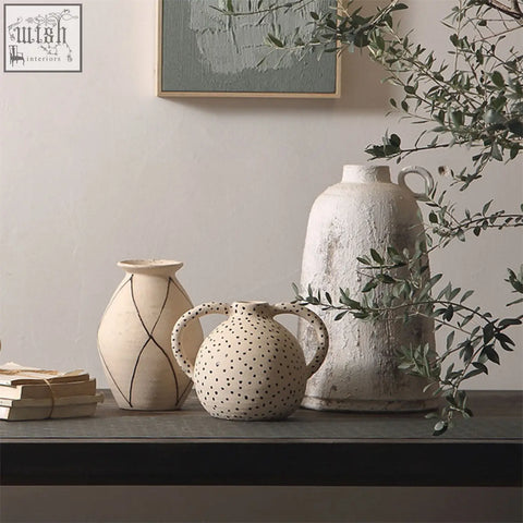 Cream-colored esme ceramic vase with black polka dots and dual handles perfect for stylish home decor