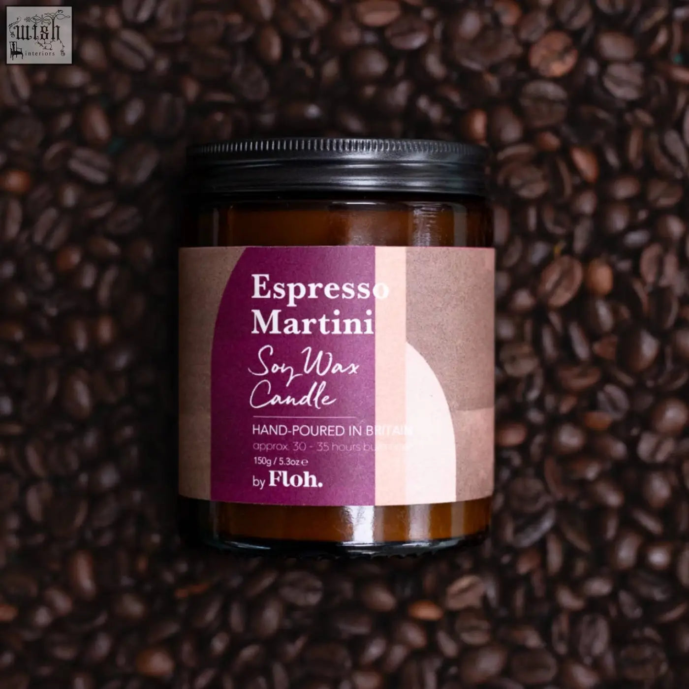 A dark amber glass jar with black lid holding an espresso martini soy wax candle by floh sustainably sourced