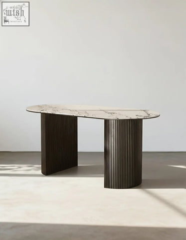 Elegant esther oval dining table with white marble top and dark vertically ribbed metal legs perfect for dining room