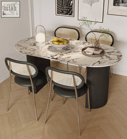 Esther oval dining table with marble-veined sintered stone top and dark gray ribbed pedestal base perfect dining table