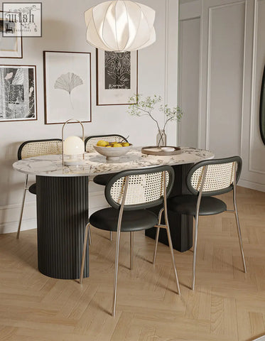 Modern esther oval dining table with marble top and black ribbed pedestal base perfect for stylish dining spaces