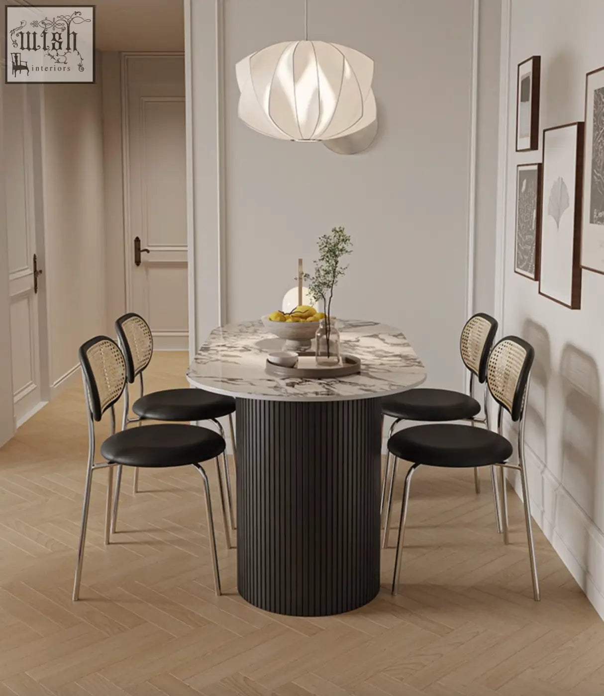 Esther oval dining table with a white marble top and black ribbed cylindrical base perfect modern dining table