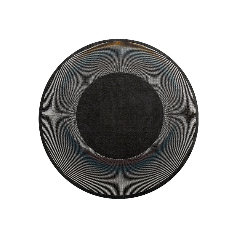 Black circular etaoline round living rug with textured ribbed pattern perfect for round living room spaces